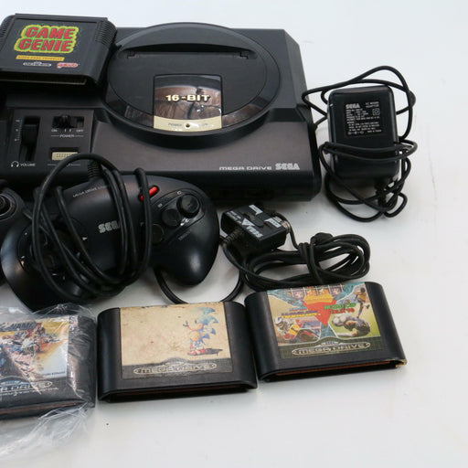 SEGA Mega Drive Games Console Bundle 2 Controllers, x16 Games, Game Genie & More - Good - Attic Discovery Shop